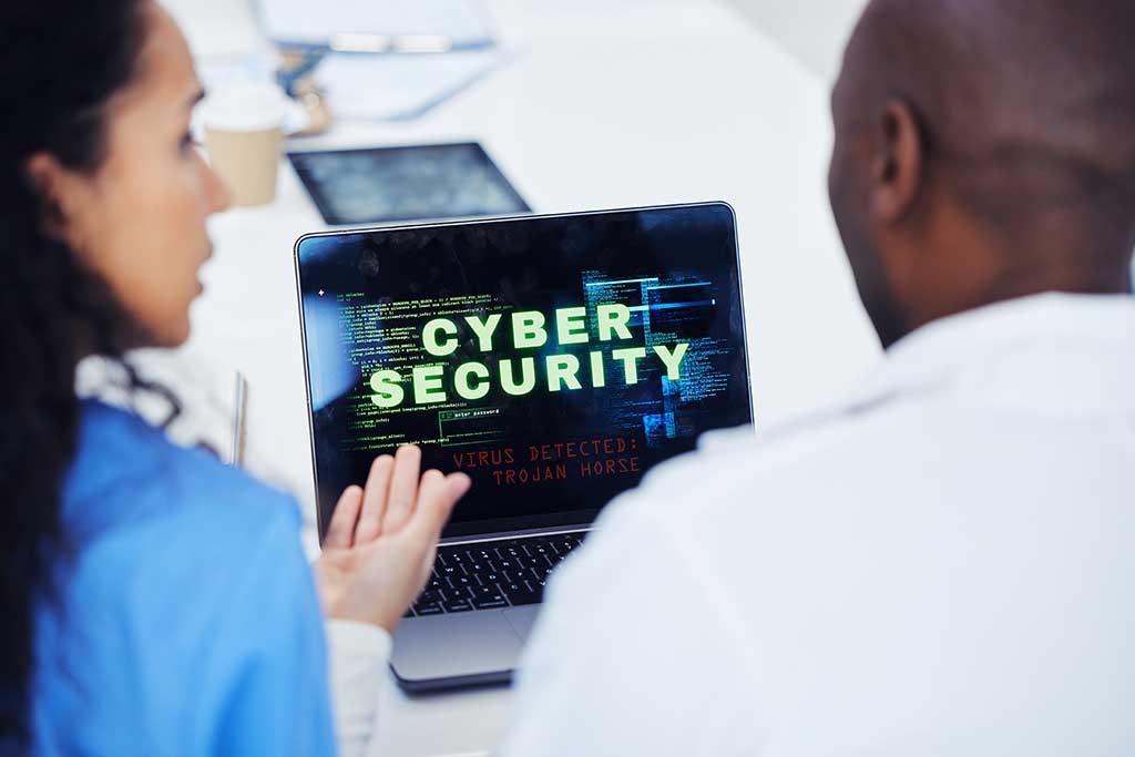 Woman presenting OcalaCode.com’s cyber security services with a digital security shield icon in the background.