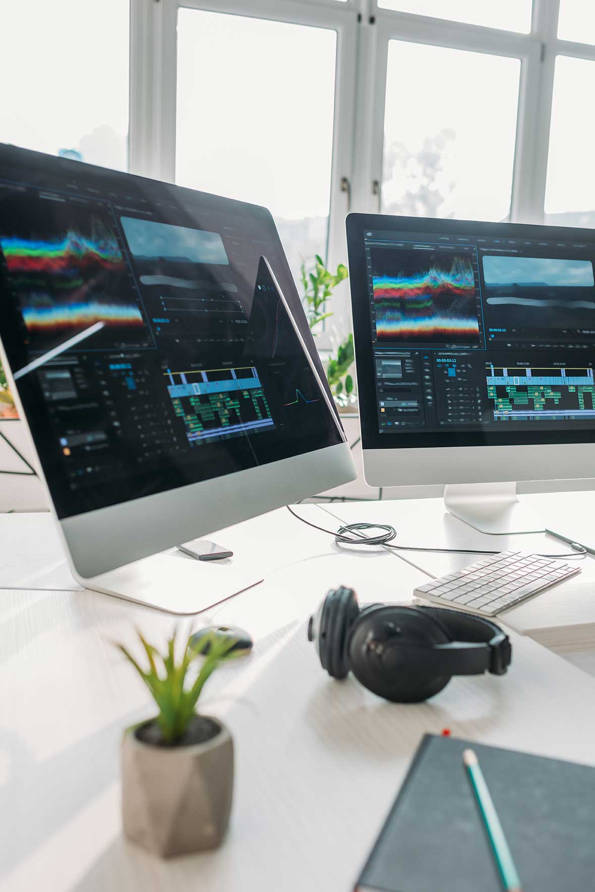 Two monitors displaying OcalaCode.com web development projects, symbolizing modern website design, coding, and responsive development.